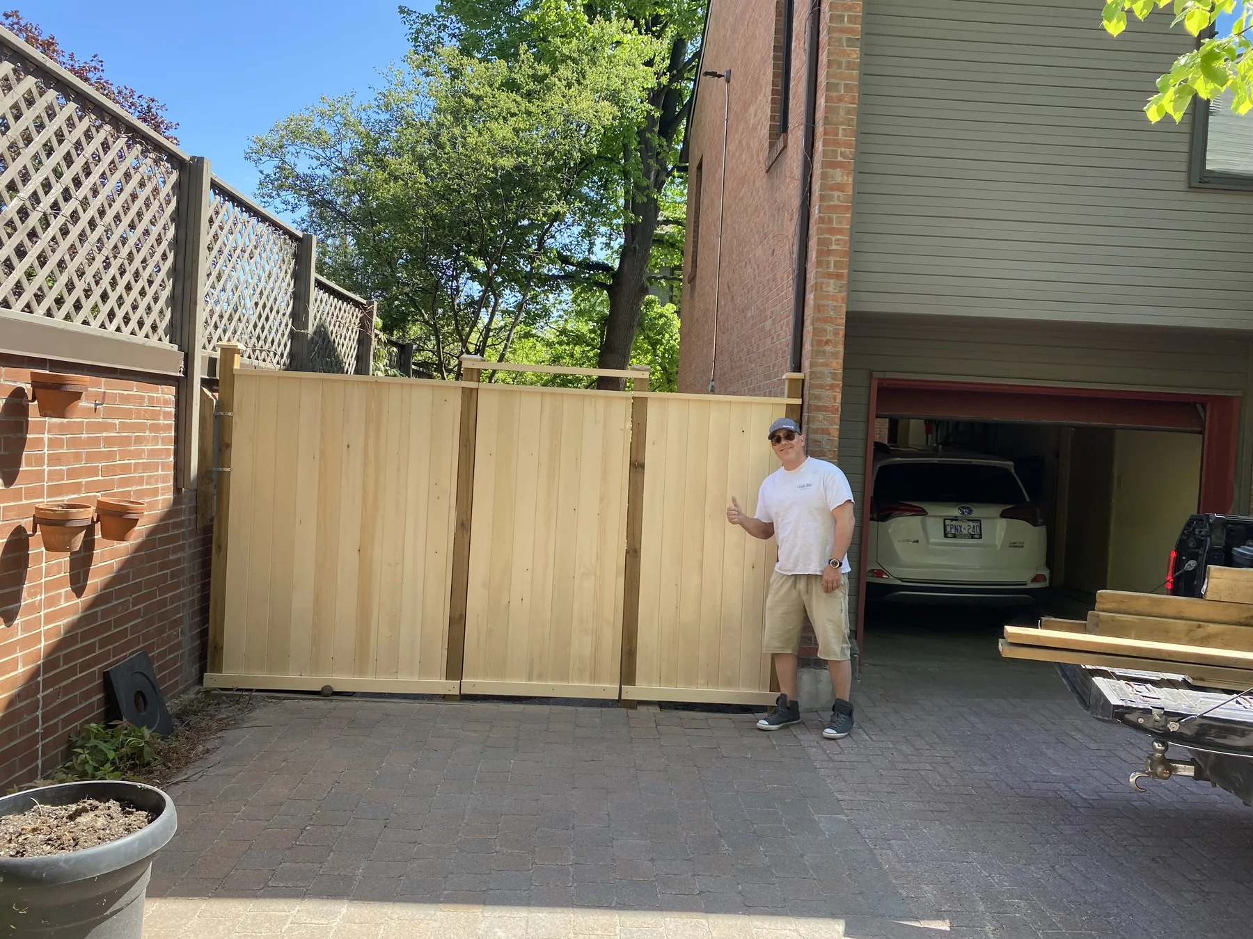 fence with gate into driveway area